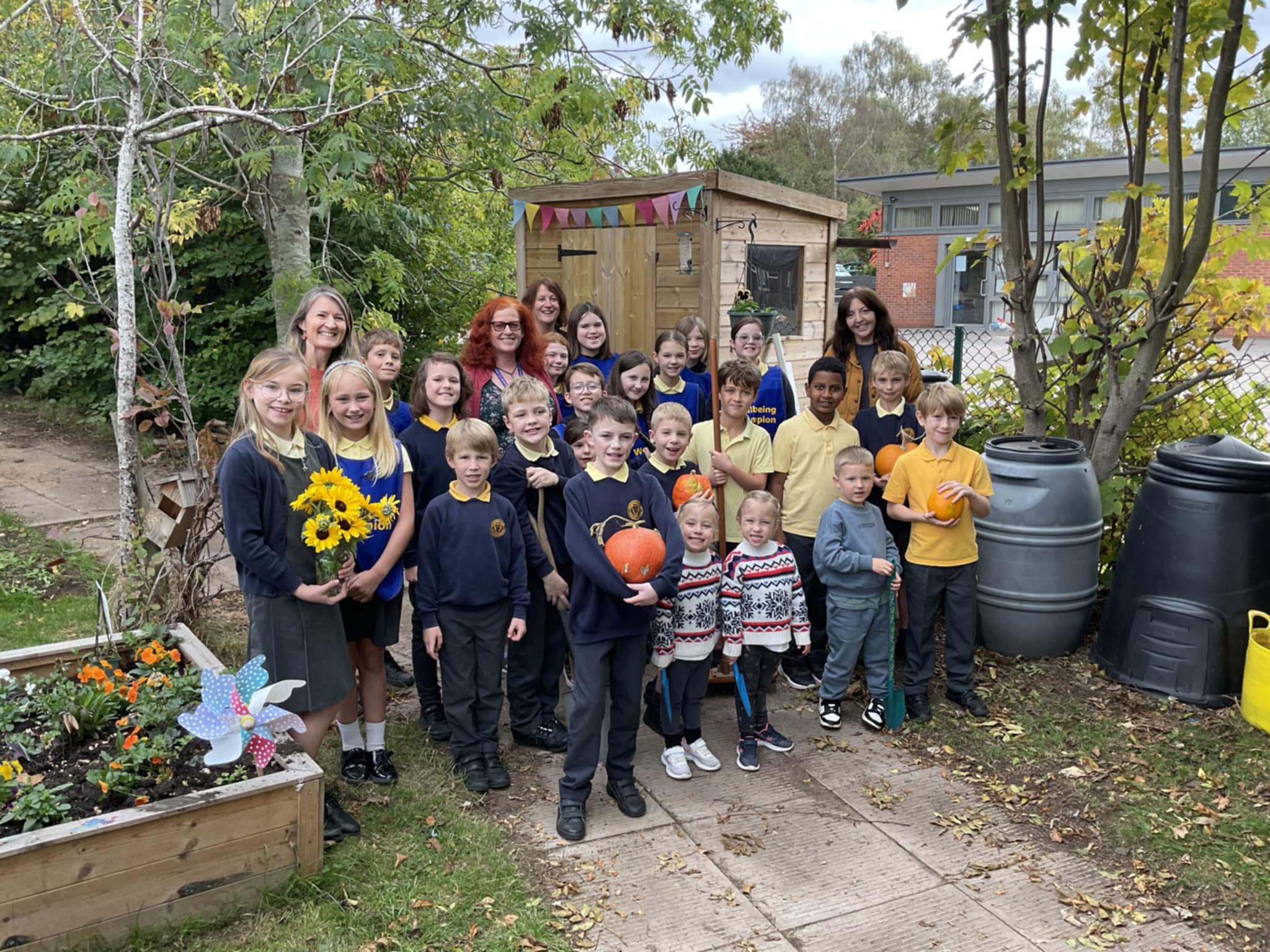 Cllr Karen Holmes meeting NMPS Children in their Wellbeing Garden and Allotment