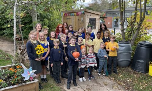 Cllr Karen Holmes meeting NMPS Children in their Wellbeing Garden and Allotment
